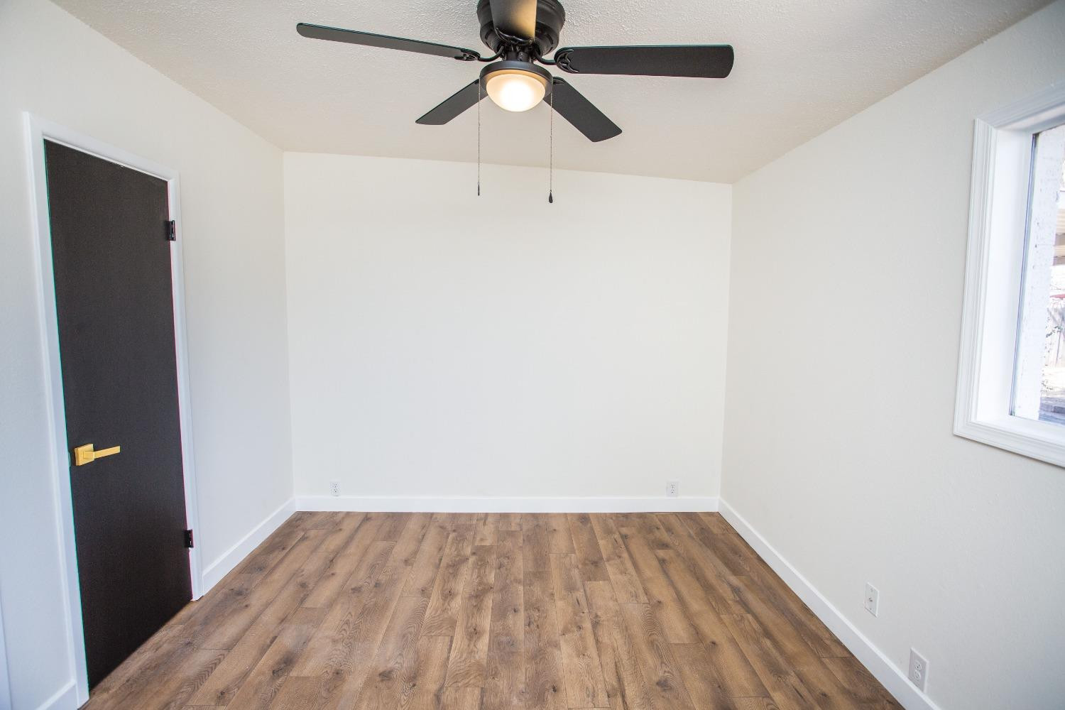 2728 66th Street Lubbock, TX 79413 - Photo 13 of 22 wooden floor in an empty room