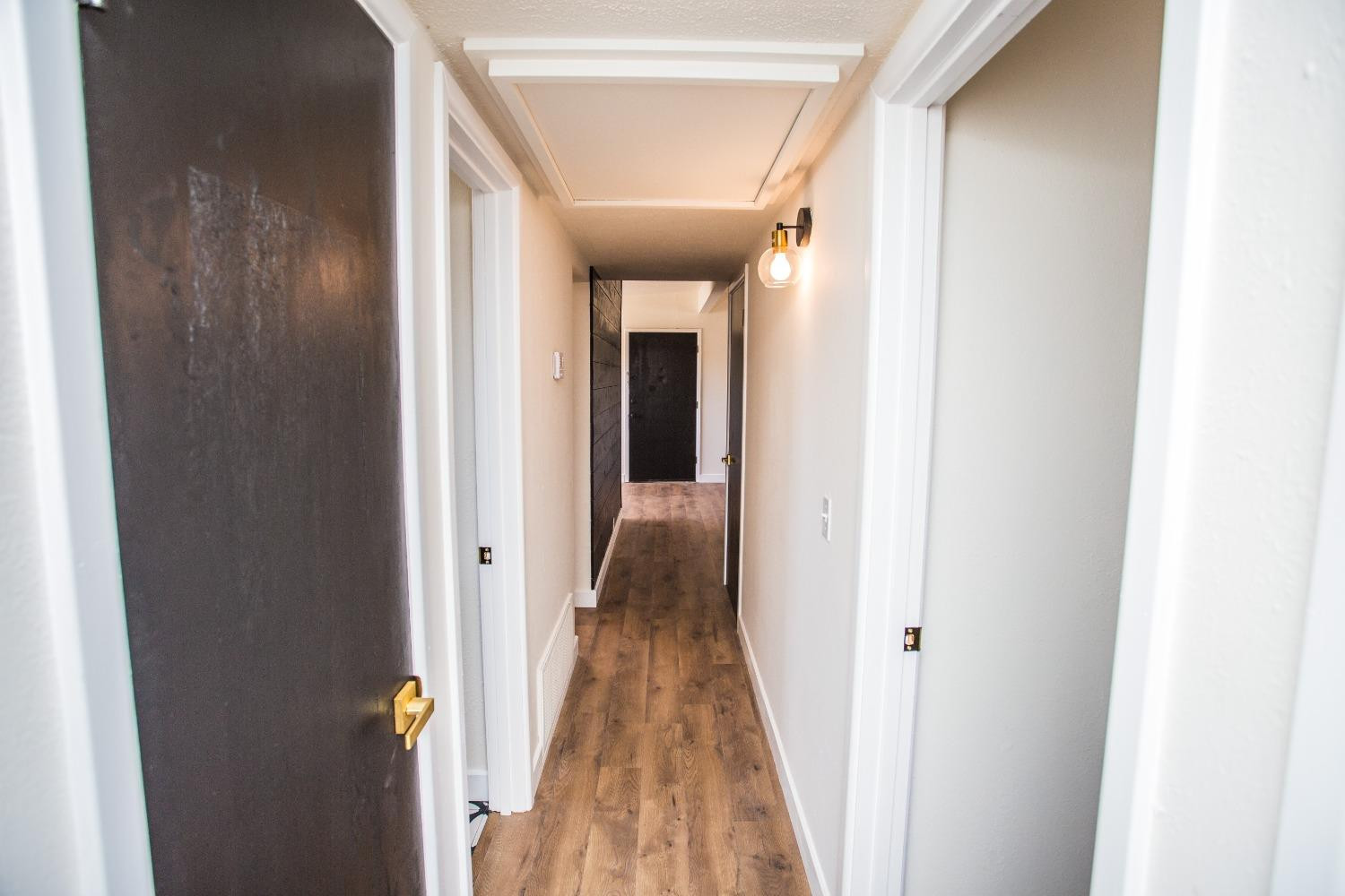 2728 66th Street Lubbock, TX 79413 - Photo 18 of 22 a view of a hallway with wooden floor