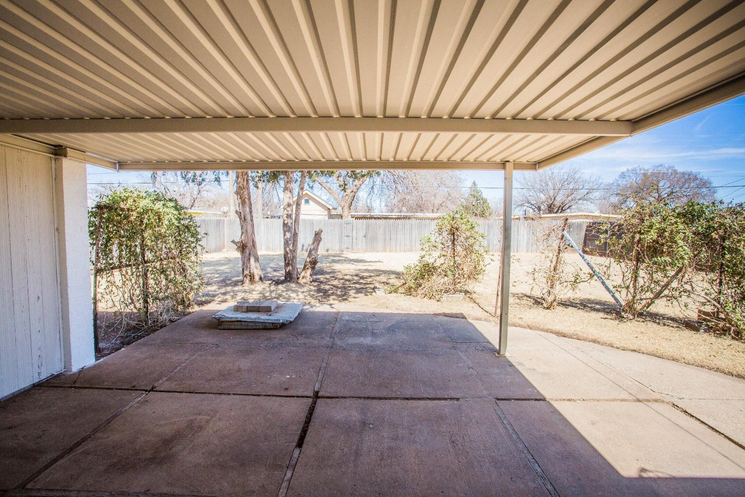 2728 66th Street Lubbock, TX 79413 - Photo 19 of 22 a view of a room with window and wooden floor