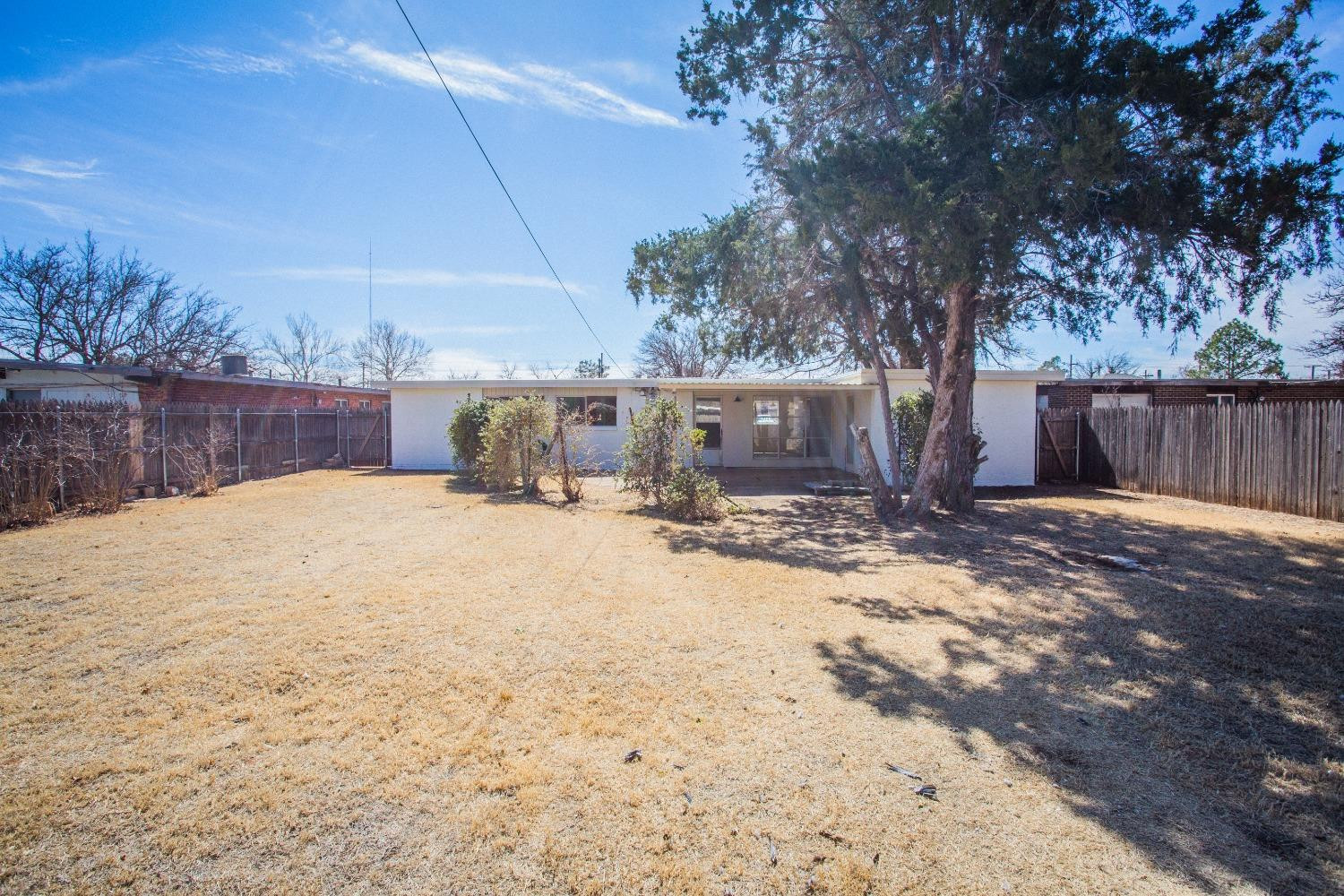 2728 66th Street Lubbock, TX 79413 - Photo 21 of 22 a view of a backyard of the house