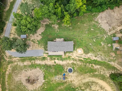 an aerial view of house with yard