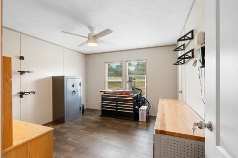 a view of hallway with stairs and furniture
