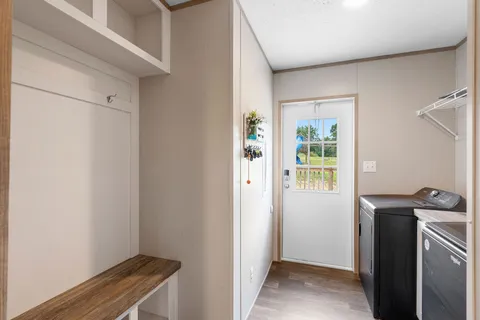 a view of a hallway with an entryway