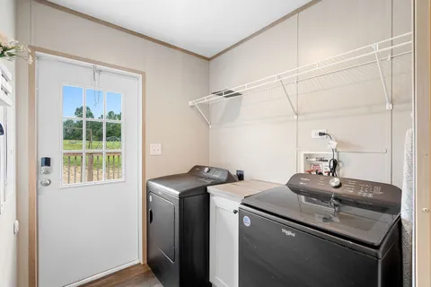 a kitchen with a sink cabinets and window