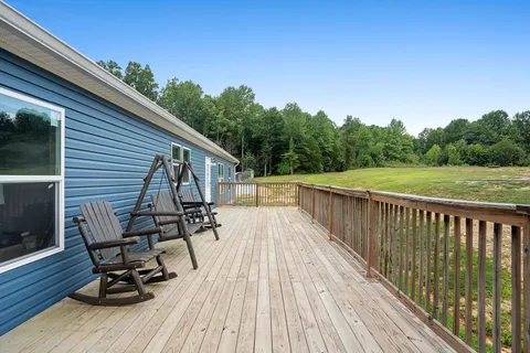 a view of a chairs on the roof deck