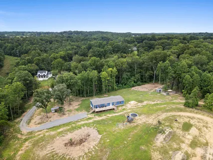 a view of a swimming pool with a yard