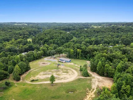 a view of a swimming pool with a yard
