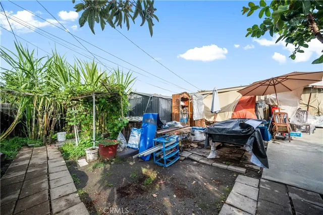 a kitchen with a sink and a refrigerator