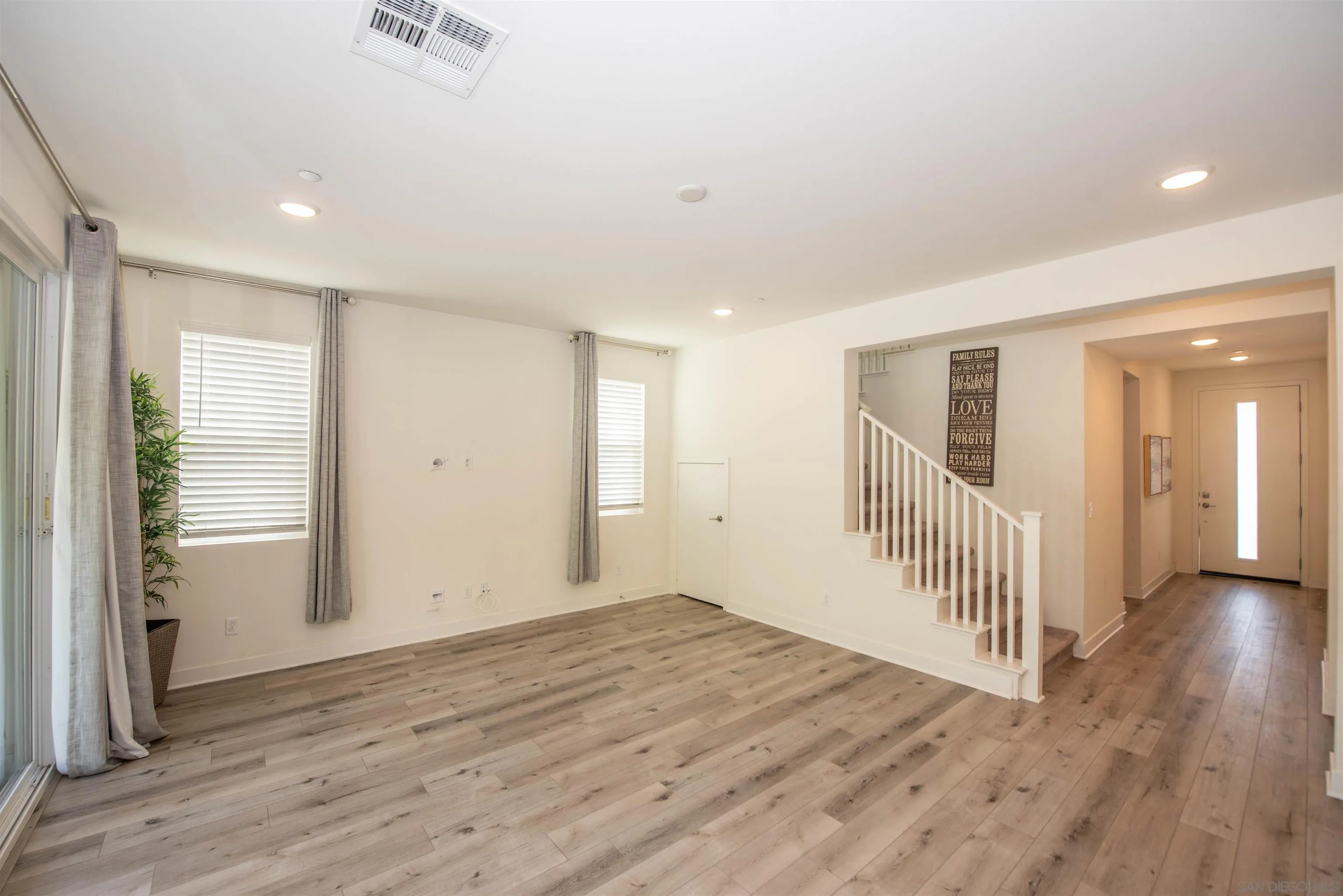 8902 Trailridge Avenue Santee, CA 92071 - Photo 11 of 38 wooden floor in an empty room with a window