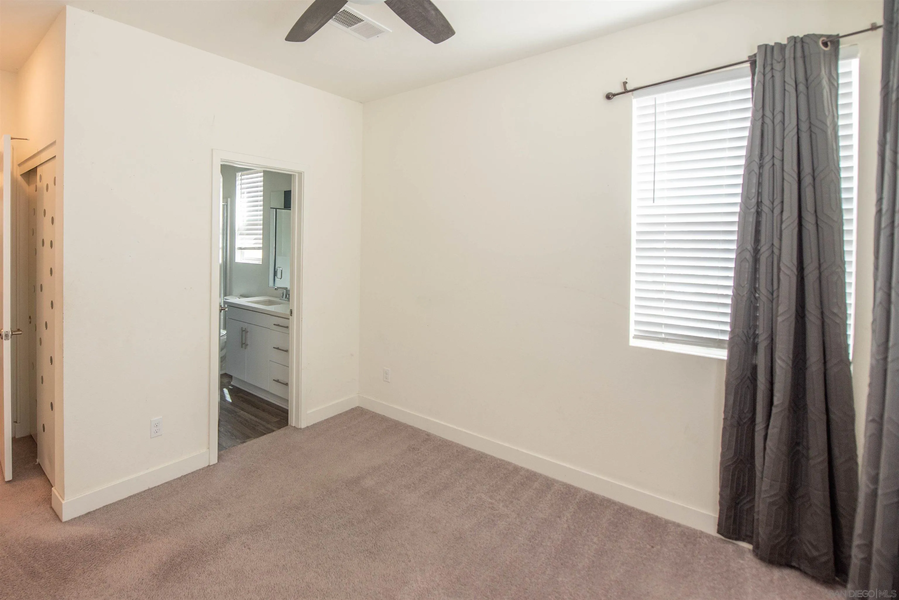 8902 Trailridge Avenue Santee, CA 92071 - Photo 13 of 38 a view of an empty room with a window