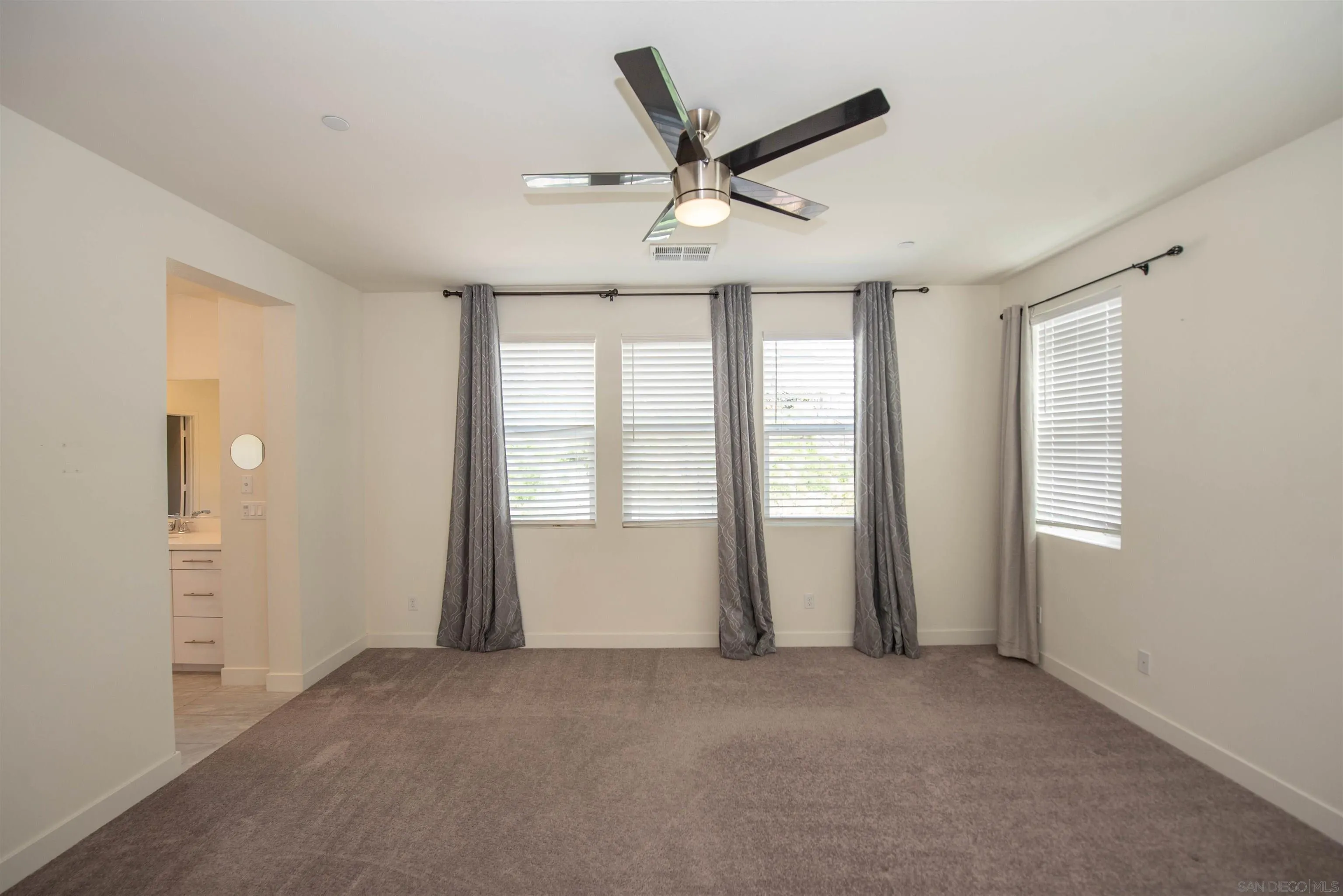 8902 Trailridge Avenue Santee, CA 92071 - Photo 14 of 38 a view of an empty room with a window