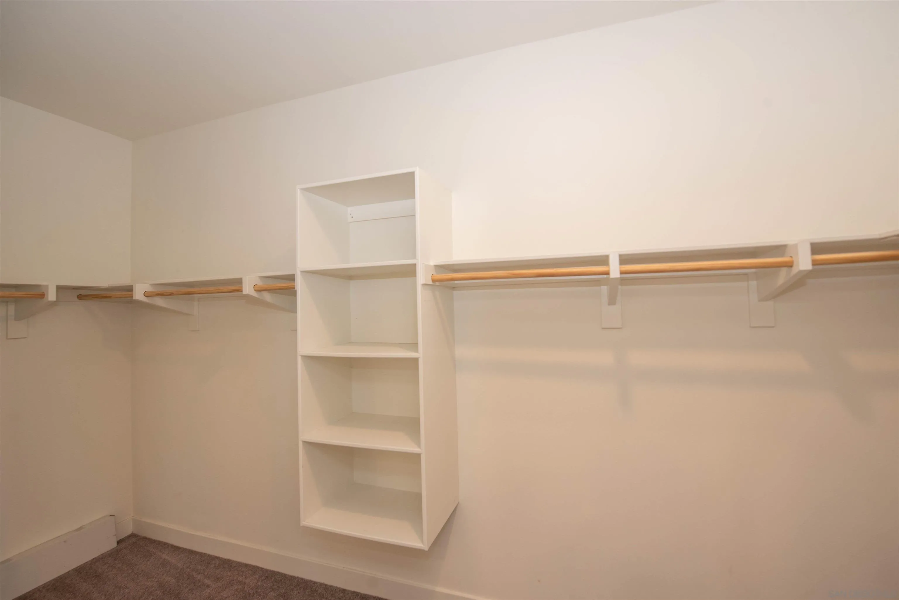 8902 Trailridge Avenue Santee, CA 92071 - Photo 17 of 38 a view of a room with racks on the wall
