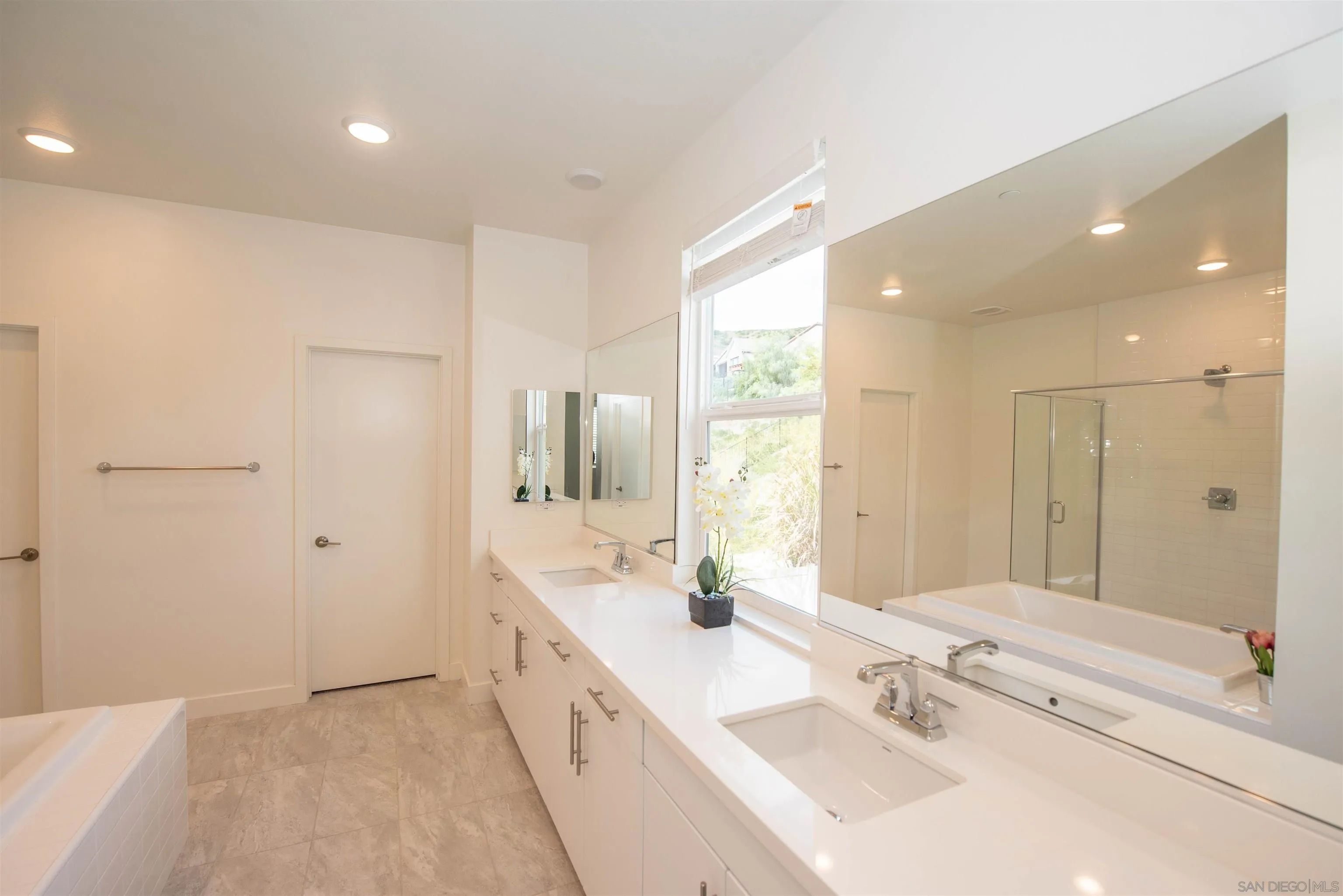 8902 Trailridge Avenue Santee, CA 92071 - Photo 18 of 38 a bathroom with a double vanity sink mirror and double