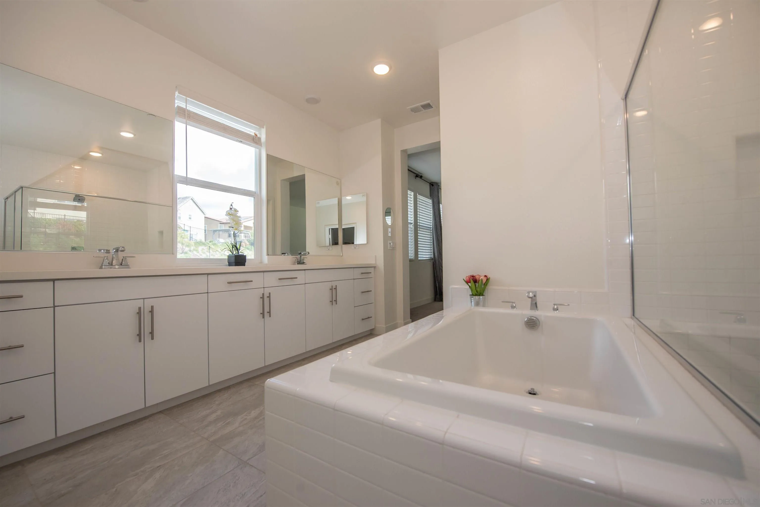8902 Trailridge Avenue Santee, CA 92071 - Photo 19 of 38 a spacious bathroom with a tub sink and mirror