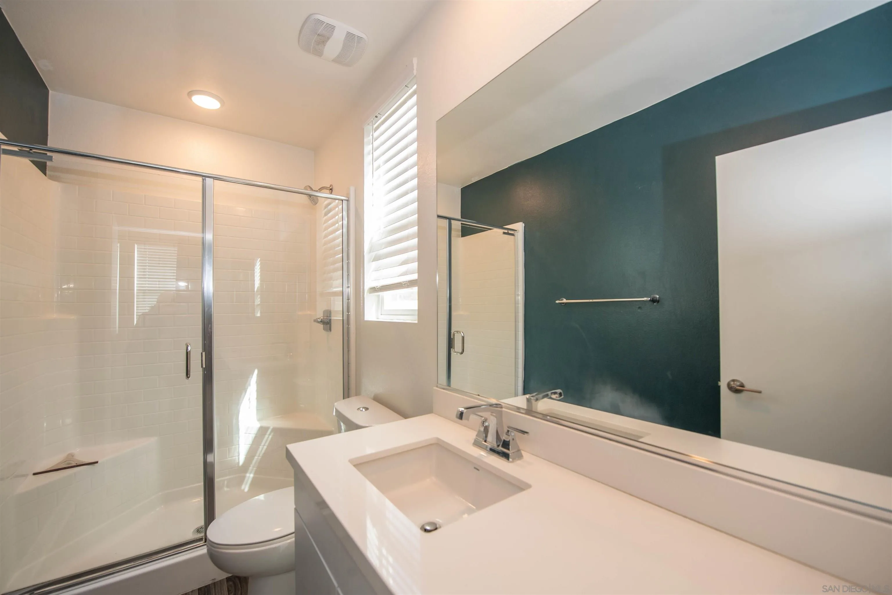 8902 Trailridge Avenue Santee, CA 92071 - Photo 23 of 38 a bathroom with a sink a toilet and shower