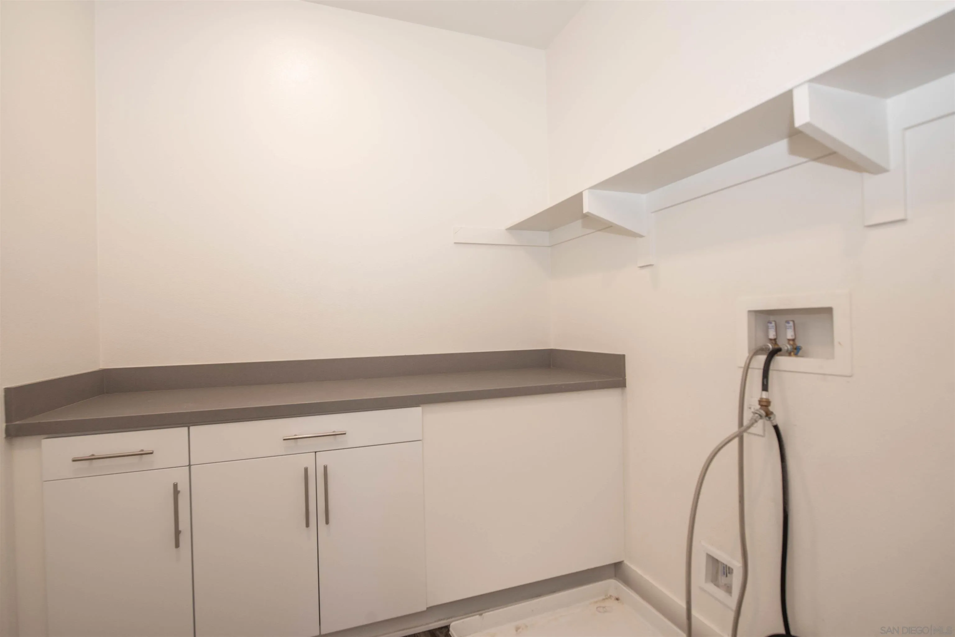 8902 Trailridge Avenue Santee, CA 92071 - Photo 27 of 38 a view of small space with racks on the wall