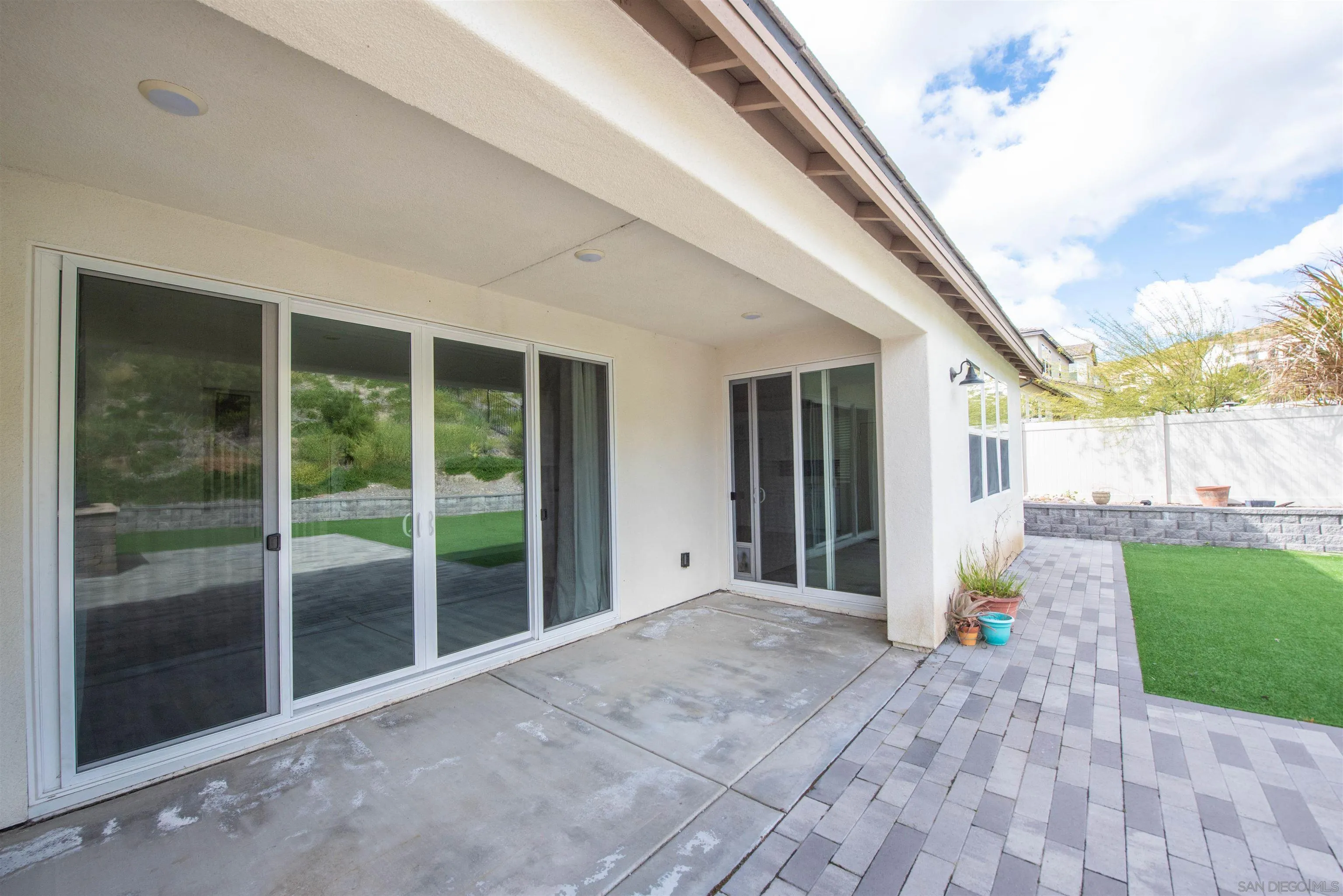 8902 Trailridge Avenue Santee, CA 92071 - Photo 28 of 38 a view of a house with backyard and porch