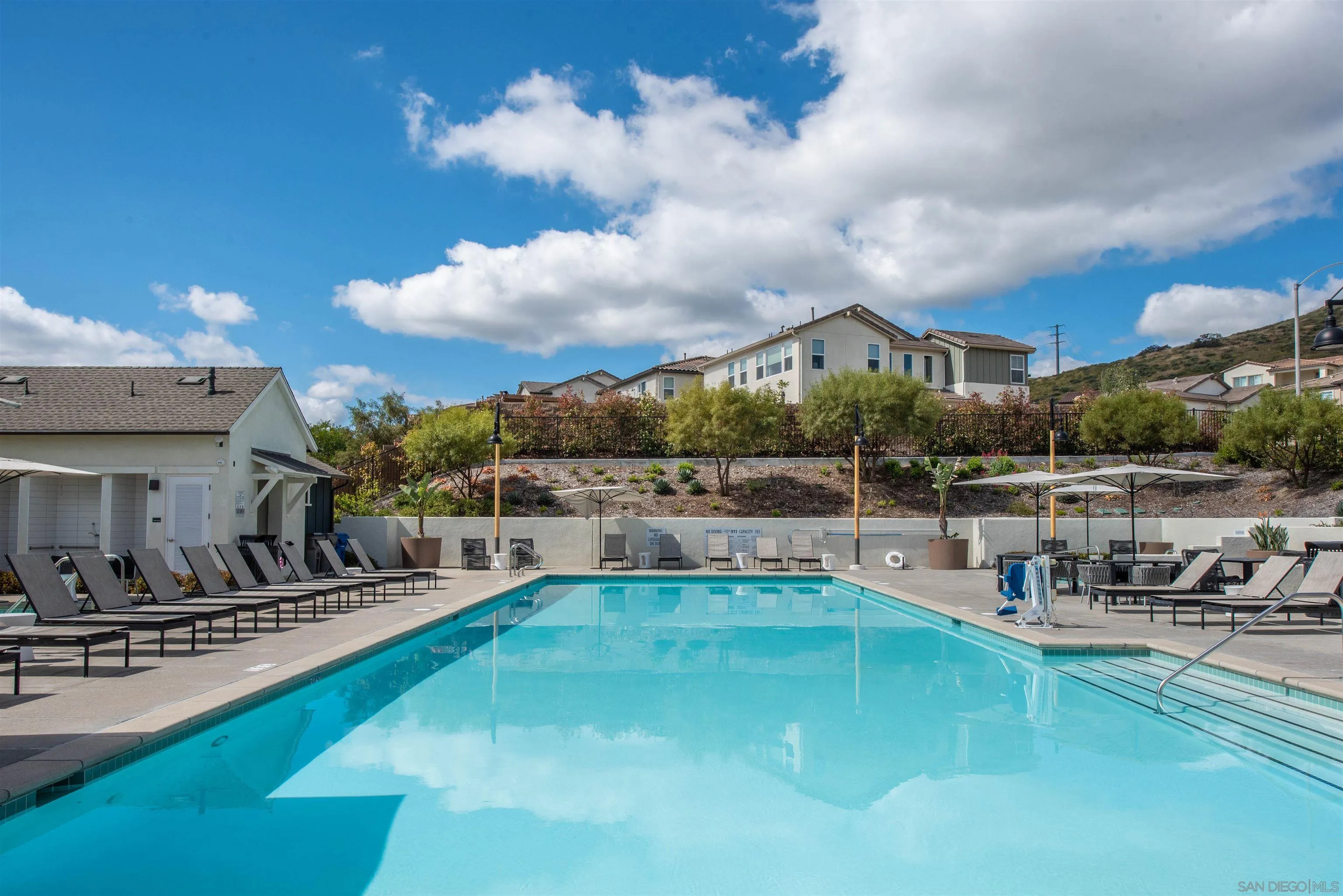 8902 Trailridge Avenue Santee, CA 92071 - Photo 38 of 38 a view of a swimming pool with outdoor seating