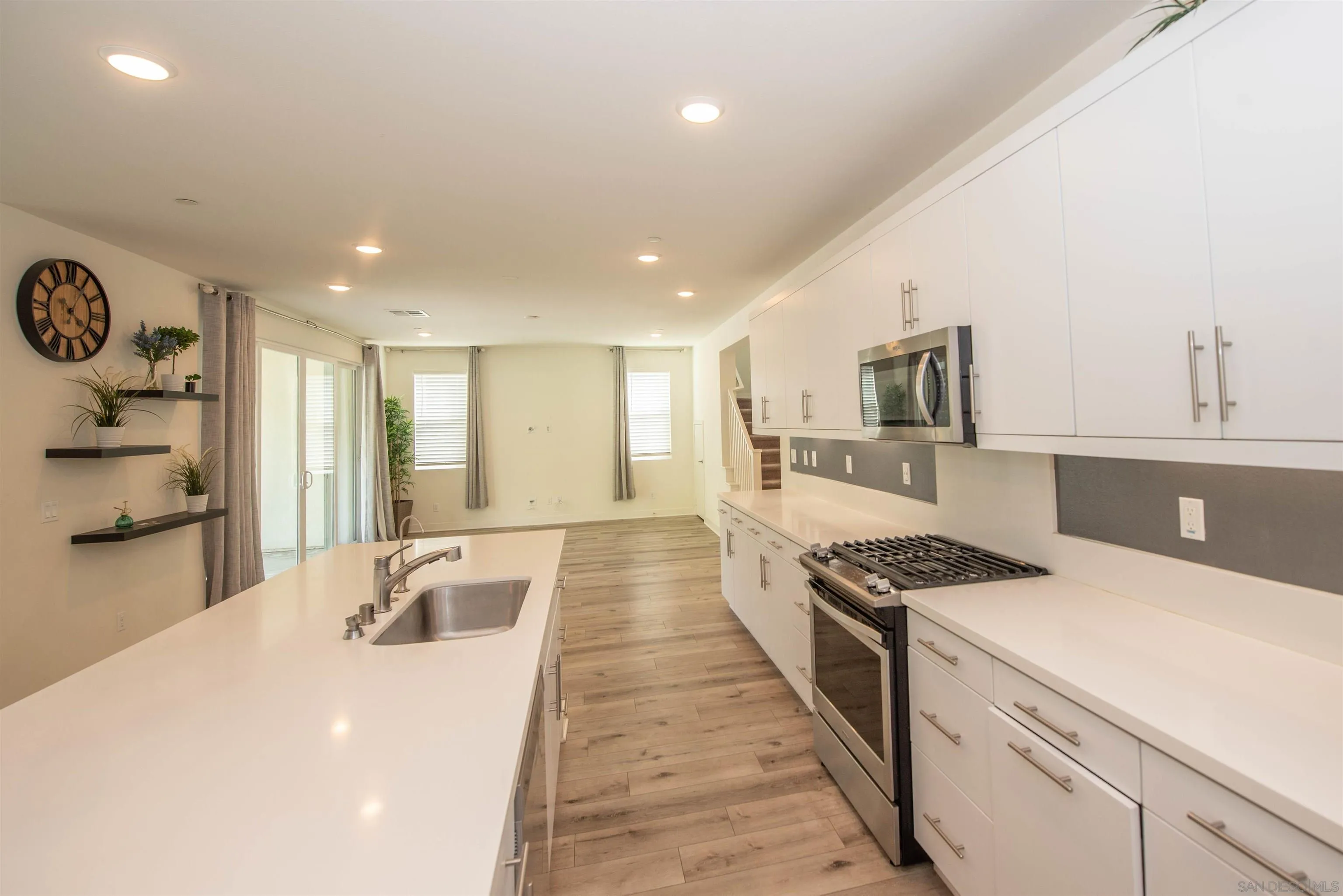 8902 Trailridge Avenue Santee, CA 92071 - Photo 8 of 38 a kitchen with stainless steel appliances granite countertop a sink stove and refrigerator