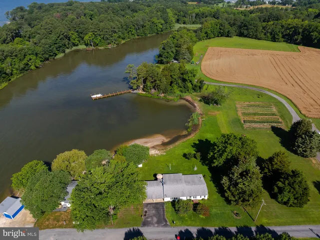 a living room with a fireplace and a flat screen tv