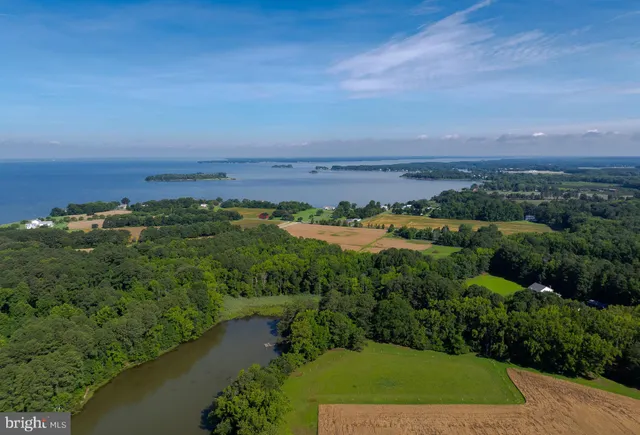 a room with stainless steel appliances kitchen island granite countertop furniture and a kitchen view