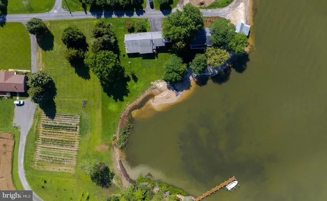 a kitchen with granite countertop a sink stove and cabinets