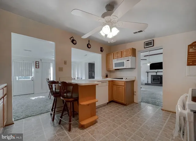 a bedroom with a bed and chandelier