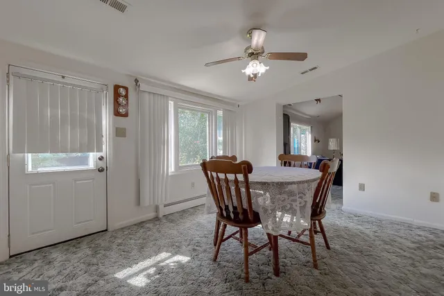 a view of a lake with a house in the background