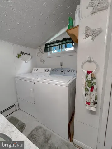 a view of a backyard with large trees