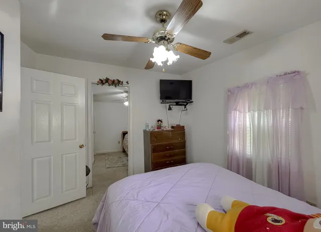 an aerial view of a houses with a lake view