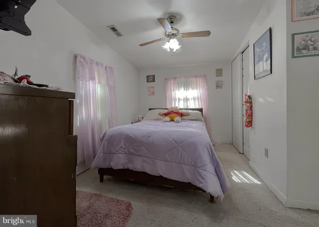 an aerial view of a houses with a lake view