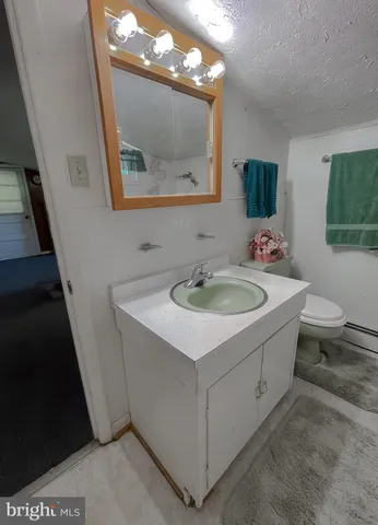 a view of a garden with a building in the background