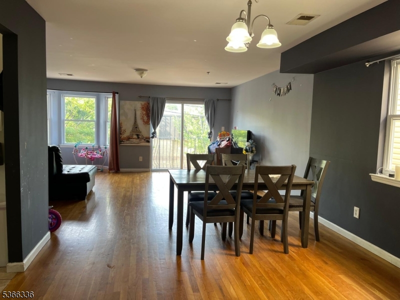 27 Camp Street, Unit 3 Newark, NJ 07102 - Photo 2 of 23 a view of a dining room with furniture window and wooden floor
