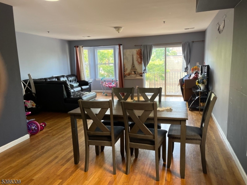 27 Camp Street, Unit 3 Newark, NJ 07102 - Photo 4 of 23 a dining room with furniture and wooden floor