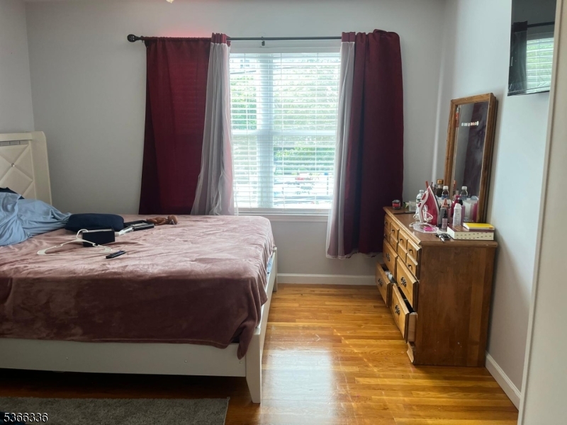 27 Camp Street, Unit 3 Newark, NJ 07102 - Photo 7 of 23 a bedroom with a bed and large windows