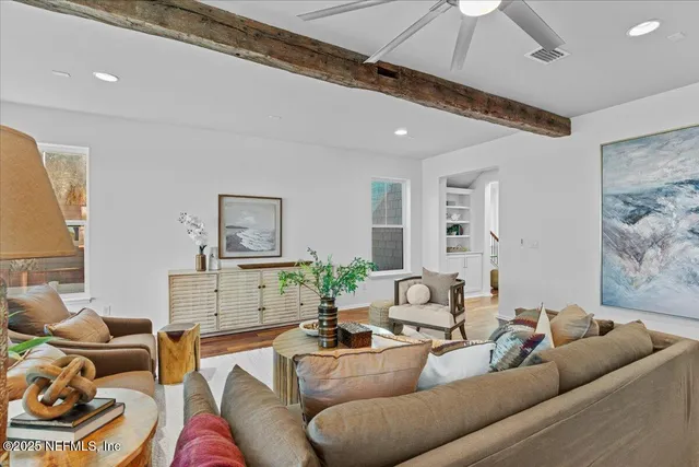 a kitchen with sink a refrigerator and wooden floor