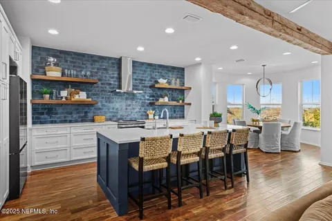 a bathroom with a granite countertop sink mirror and shower