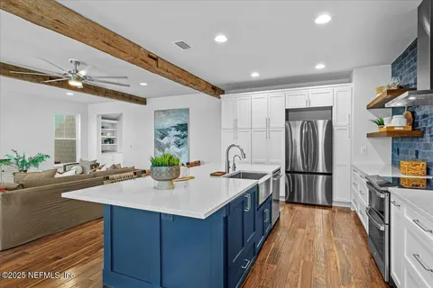 a view of entryway with wooden floor and a potted plant