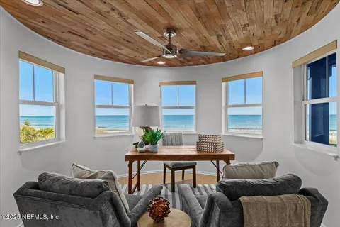 a spacious bathroom with a double vanity sink a mirror a bathtub and a window