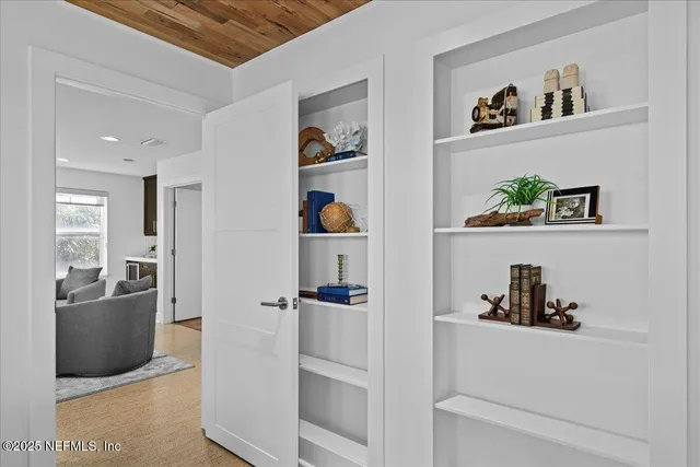 a bathroom with double sink and a mirror