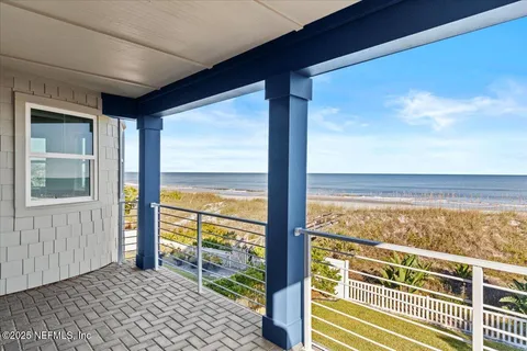 a bedroom with a bed and a table with wooden floor