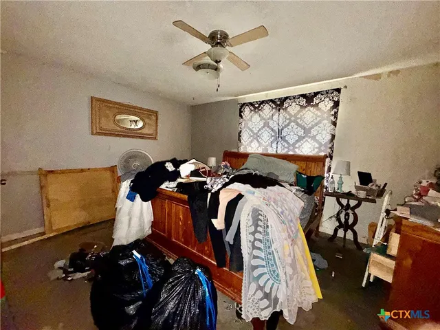 a bed room with a bed and a window