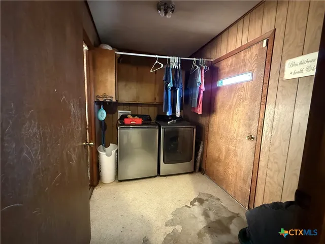 a utility room with dryer and washer