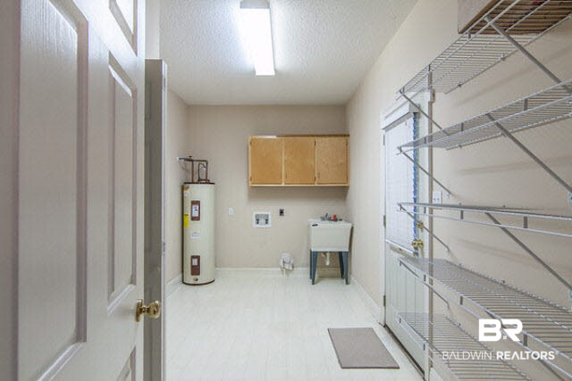 636 Southern Way Daphne, AL 36527 - Photo 14 of 34 Pantry is huge with a deep sink and washer dryer hook up.