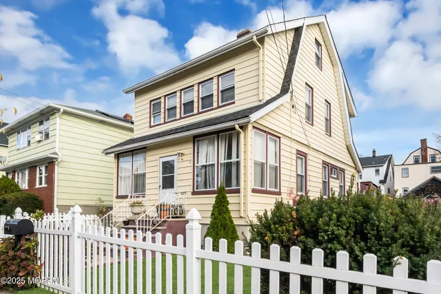 a front view of a house with a porch