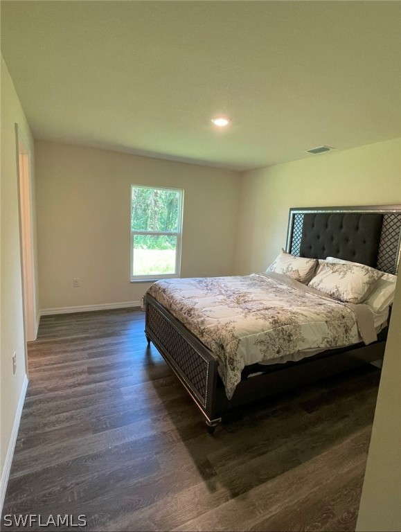 5010 Sun Court LaBelle, FL 33935 - Photo 13 of 20 a bedroom with a bed and window