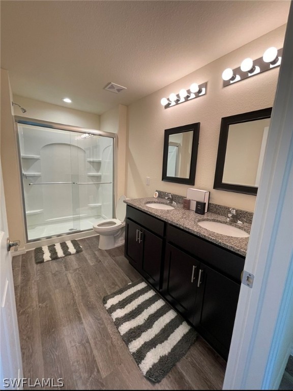 5010 Sun Court LaBelle, FL 33935 - Photo 15 of 20 a bathroom with a double vanity sink and a mirror