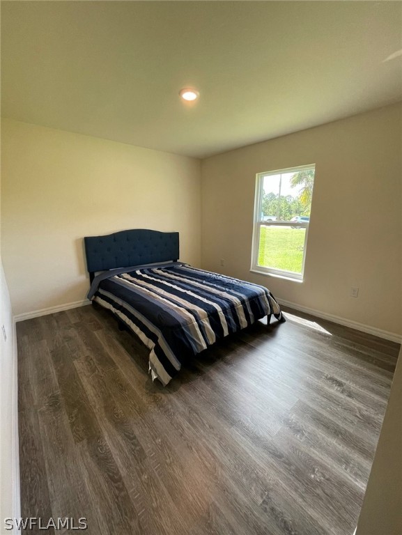 5010 Sun Court LaBelle, FL 33935 - Photo 16 of 20 a bedroom with a bed and a window