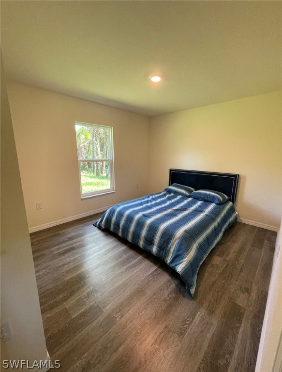 5010 Sun Court LaBelle, FL 33935 - Photo 17 of 20 a bedroom with a bed and a window