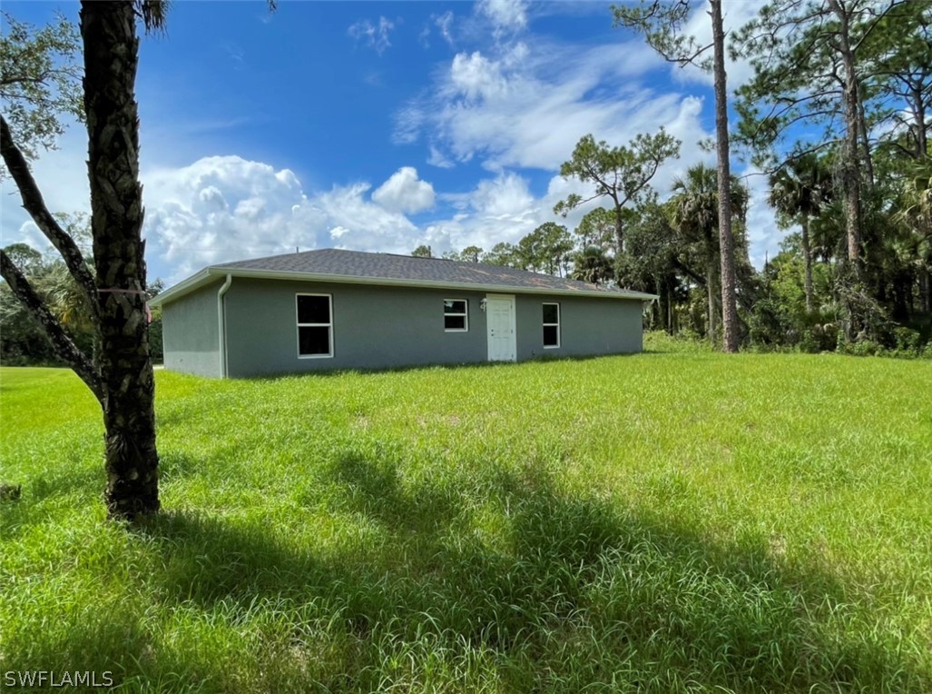 5010 Sun Court LaBelle, FL 33935 - Photo 2 of 20 a view of a house with a yard
